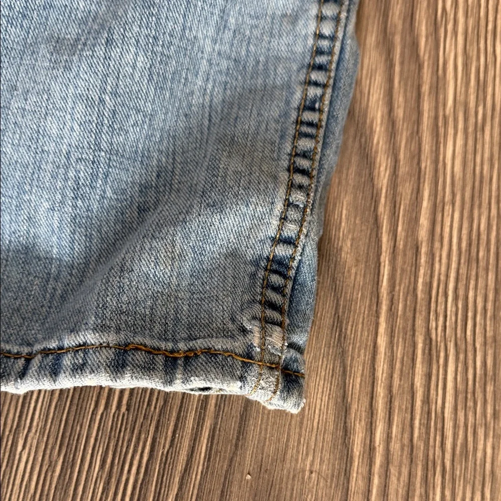 Levi's Light Blue Straight Jeans with Distressed Details